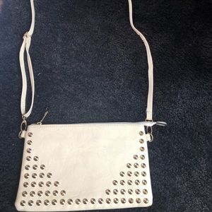 Crossbody bag or clutch in sand with studs